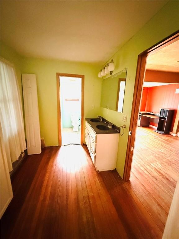 314 W Maple St, Hoopeston, IL 60942 - interior space featuring dark wood-style flooring and a sink