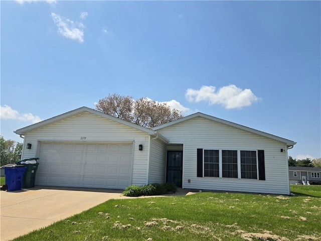 ranch-style home featuring an attached garage, driveway, and a front lawn
