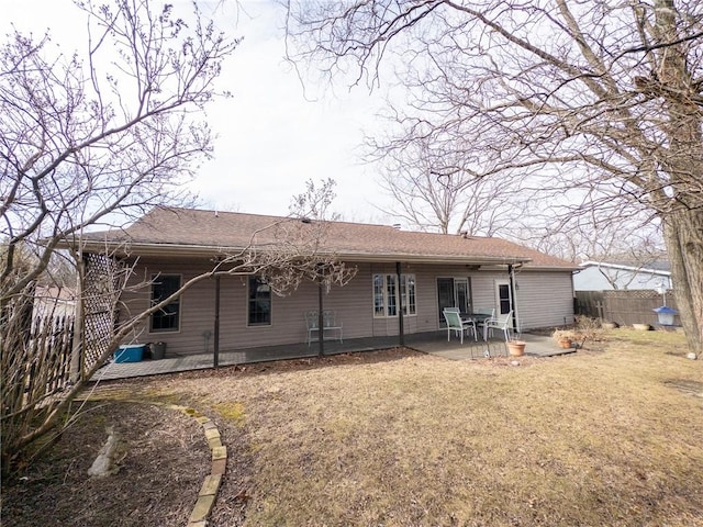 back of house featuring a patio and a fenced backyard