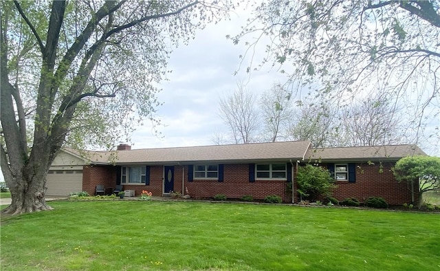 ranch-style house with a garage, brick siding, a chimney, and a front lawn