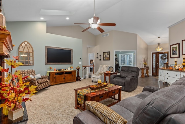 living room with light carpet, high vaulted ceiling, and ceiling fan