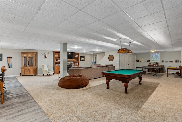 recreation room with a paneled ceiling, carpet floors, and billiards