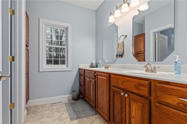 bathroom featuring tile patterned floors and vanity