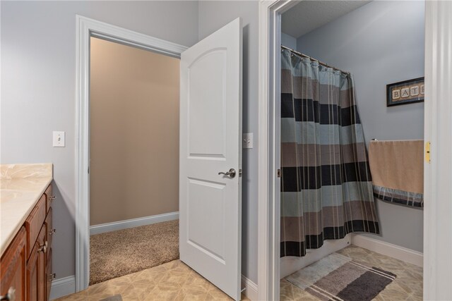 bathroom with vanity and walk in shower