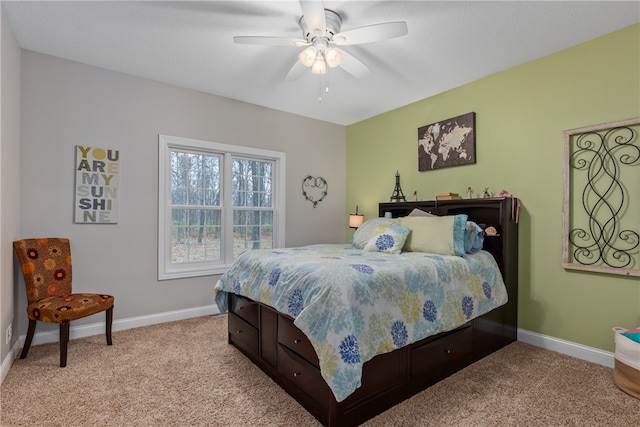 bedroom with ceiling fan and light colored carpet