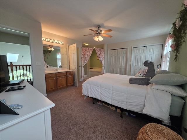 607 Beyers Lake Est, Pana, IL 62557 - bedroom with multiple closets, carpet floors, connected bathroom, and ceiling fan