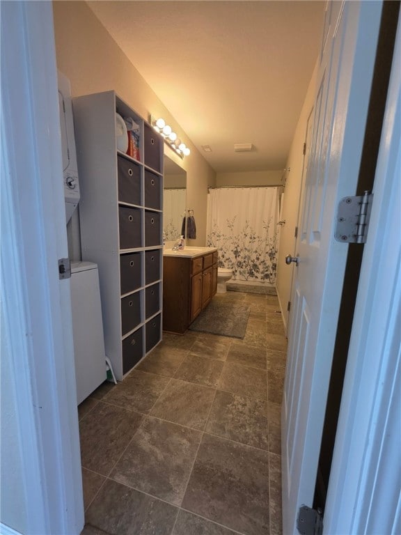 607 Beyers Lake Est, Pana, IL 62557 - bathroom featuring vanity, stone finish floors, and a shower with shower curtain