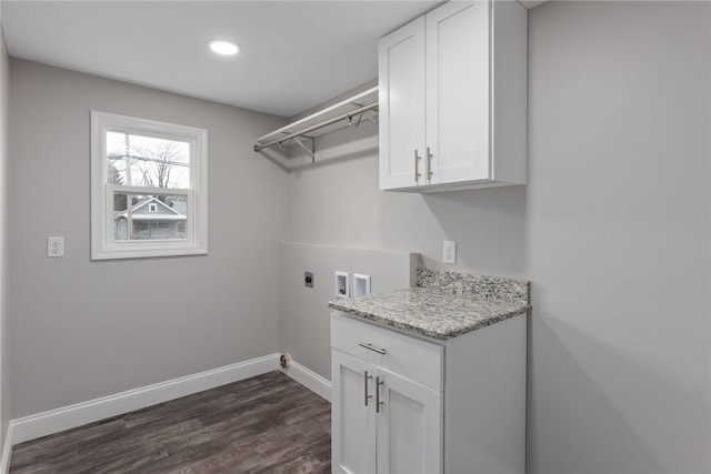 clothes washing area with cabinet space, baseboards, dark wood-style flooring, hookup for a washing machine, and electric dryer hookup