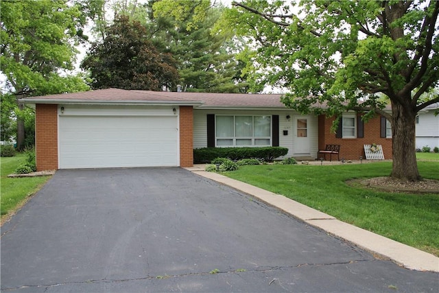 1107 N Long St, Shelbyville, IL 62565 - single story home with brick siding, asphalt driveway, a front yard, and a garage