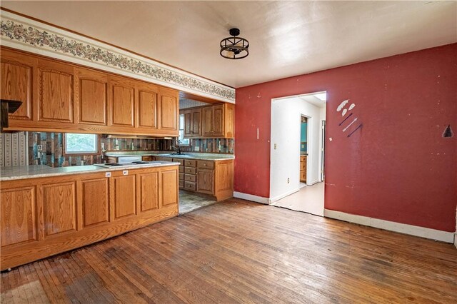 kitchen featuring brown cabinets and wood-type flooring