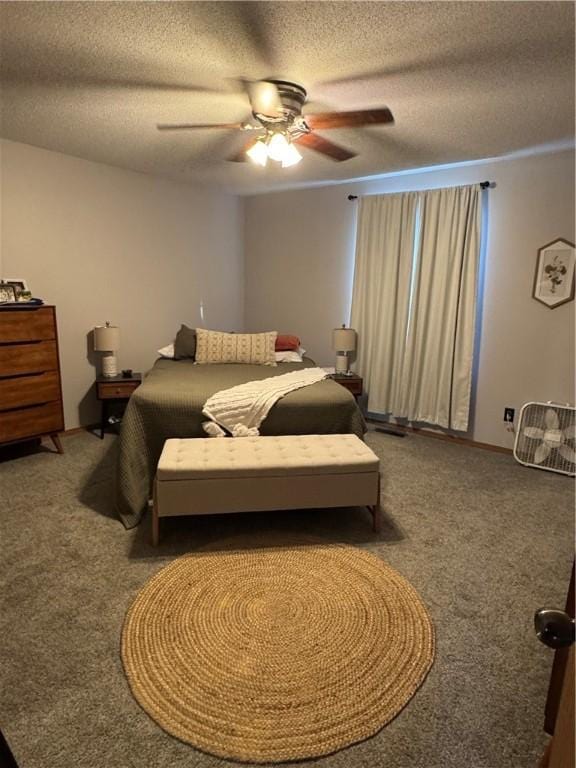 carpeted bedroom with a textured ceiling and a ceiling fan