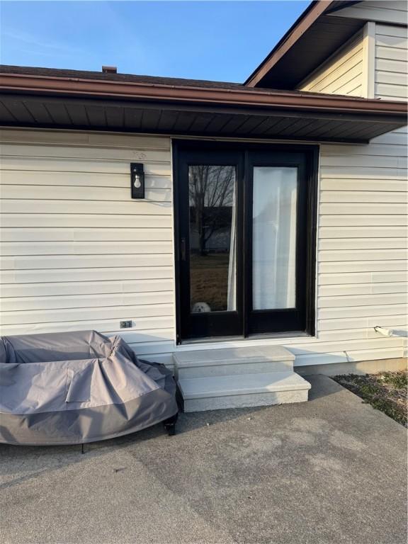 entrance to property with a patio