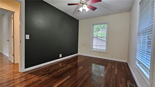 1009 E Grove Pl, Effingham, IL 62401 - spare room featuring wood finished floors, ceiling fan, baseboards, and vaulted ceiling