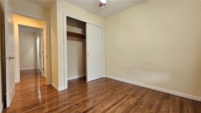 1009 E Grove Pl, Effingham, IL 62401 - unfurnished bedroom featuring wood finished floors, baseboards, and a closet