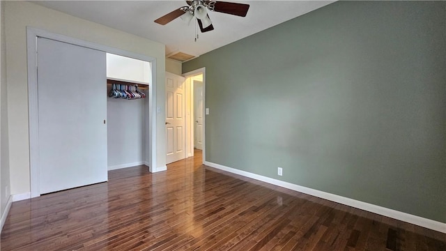 1009 E Grove Pl, Effingham, IL 62401 - unfurnished bedroom featuring wood finished floors, baseboards, a closet, and a ceiling fan