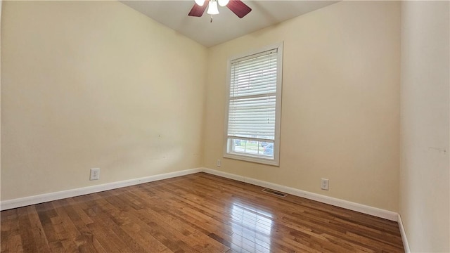 1009 E Grove Pl, Effingham, IL 62401 - empty room featuring ceiling fan, wood-type flooring, and baseboards