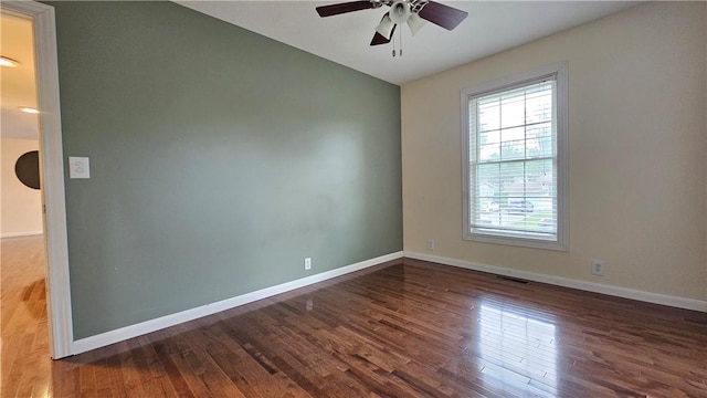 1009 E Grove Pl, Effingham, IL 62401 - unfurnished room featuring a ceiling fan, wood finished floors, baseboards, and lofted ceiling