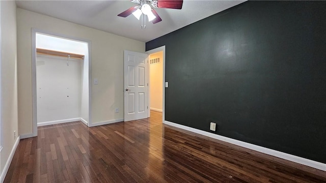 1009 E Grove Pl, Effingham, IL 62401 - unfurnished bedroom featuring wood-type flooring, baseboards, ceiling fan, and a closet