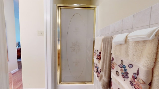 3121 Stoneridge Ct, Danville, IL 61832 - full bath featuring a stall shower and wood finished floors