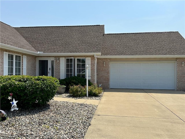 3121 Stoneridge Ct, Danville, IL 61832 - view of front facade with brick siding, a shingled roof, and driveway