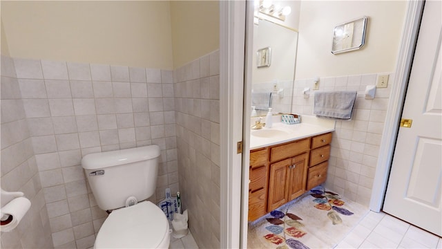 3121 Stoneridge Ct, Danville, IL 61832 - half bath with tile walls, vanity, wainscoting, and tile patterned flooring