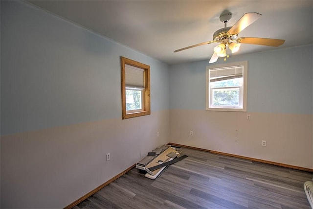 6145 Sangamon Rd, Decatur, IL 62521 - empty room featuring healthy amount of natural light, wood finished floors, and a ceiling fan