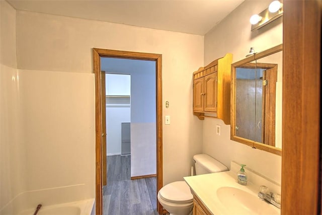 6145 Sangamon Rd, Decatur, IL 62521 - full bathroom with wood finished floors, vanity, and washtub / shower combination