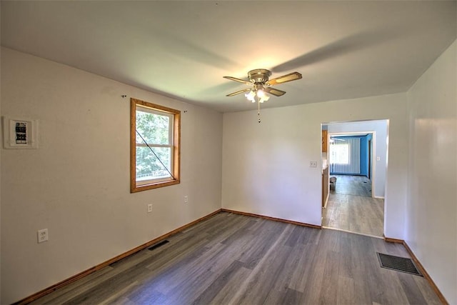 6145 Sangamon Rd, Decatur, IL 62521 - spare room with dark wood-style flooring and a ceiling fan