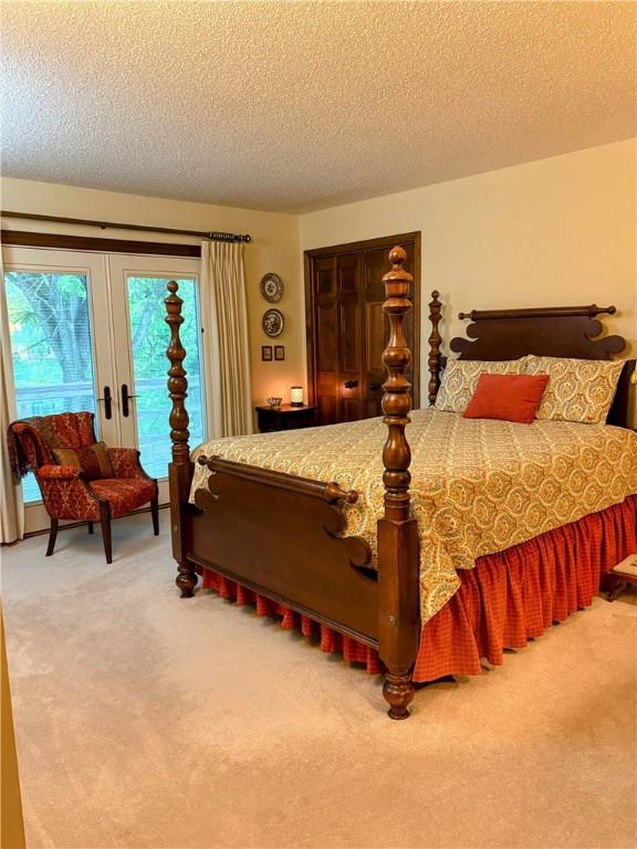2236 Seneca Dr, Charleston, IL 61920 - bedroom featuring carpet, a textured ceiling, and access to exterior