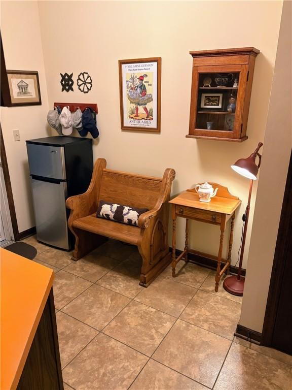 2236 Seneca Dr, Charleston, IL 61920 - living area with light tile patterned flooring and baseboards