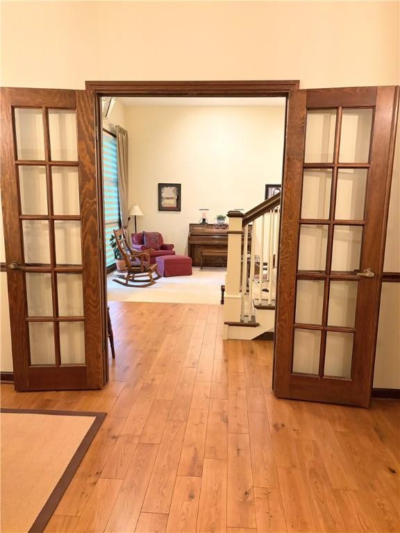 2236 Seneca Dr, Charleston, IL 61920 - hall featuring light wood-type flooring and french doors