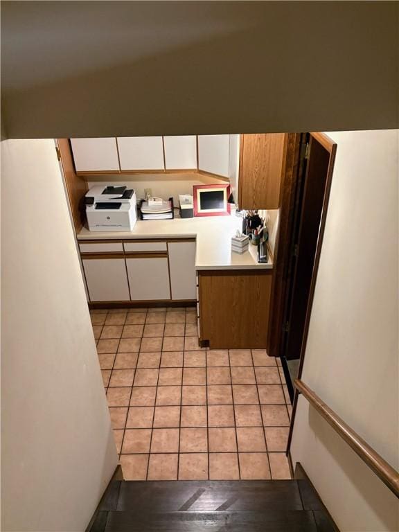 2236 Seneca Dr, Charleston, IL 61920 - kitchen featuring light countertops, white cabinets, and light tile patterned floors