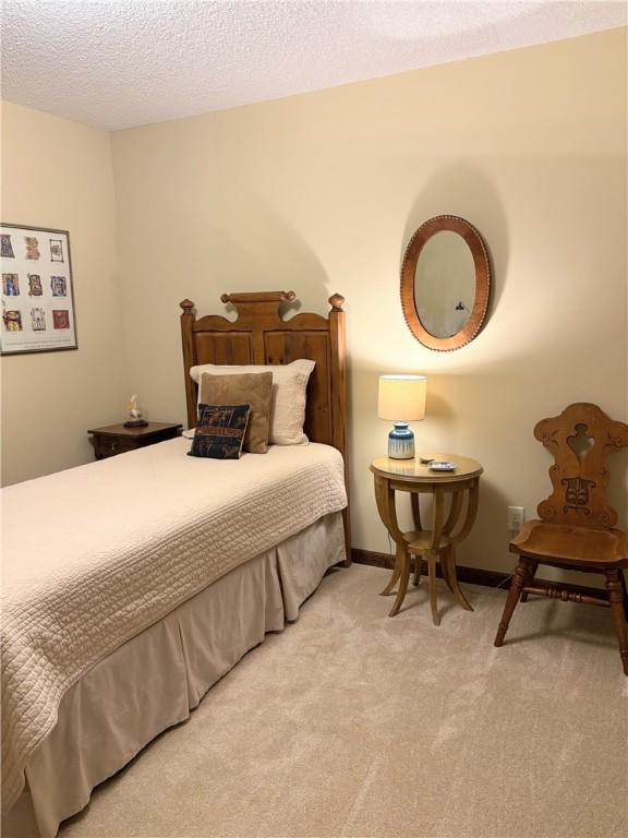 2236 Seneca Dr, Charleston, IL 61920 - carpeted bedroom featuring a textured ceiling