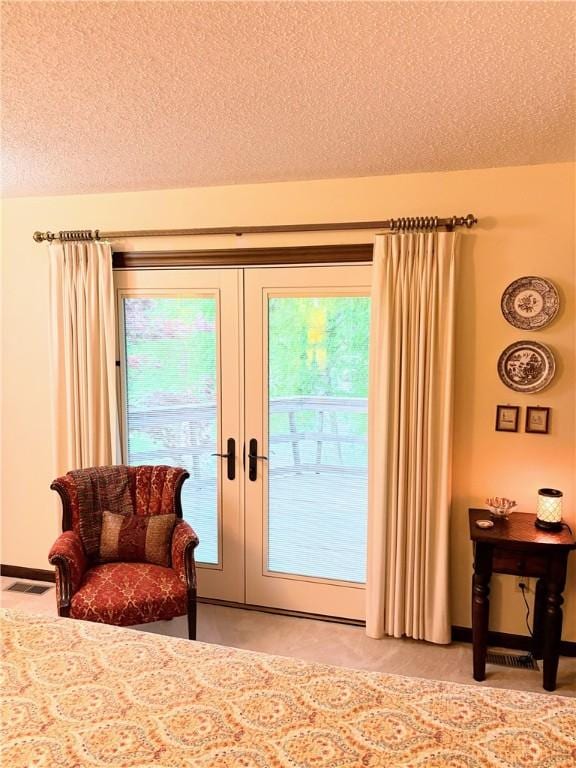 2236 Seneca Dr, Charleston, IL 61920 - bedroom featuring access to exterior, a textured ceiling, and french doors