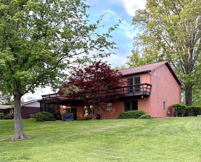 2236 Seneca Dr, Charleston, IL 61920 - rear view of house featuring a yard and a balcony