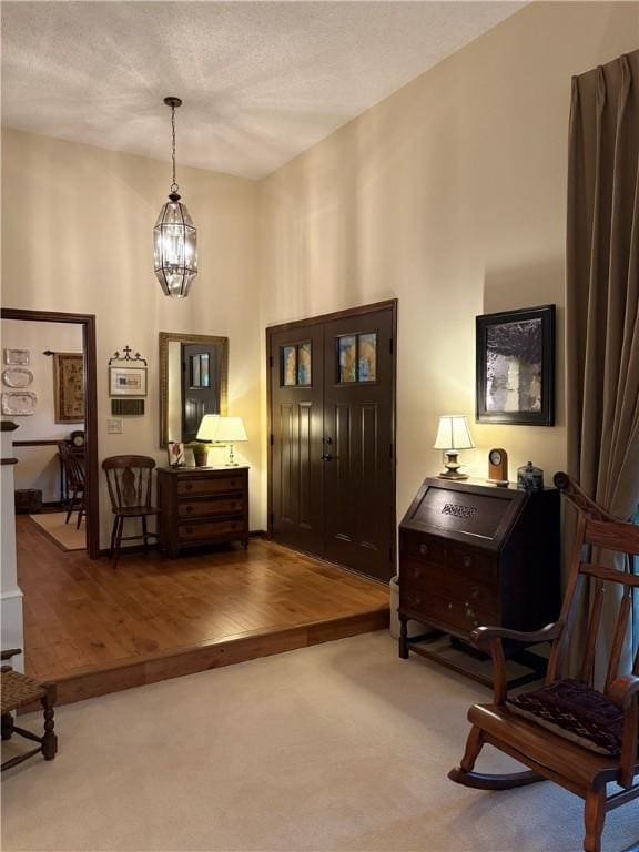 2236 Seneca Dr, Charleston, IL 61920 - entryway featuring wood finished floors and a textured ceiling