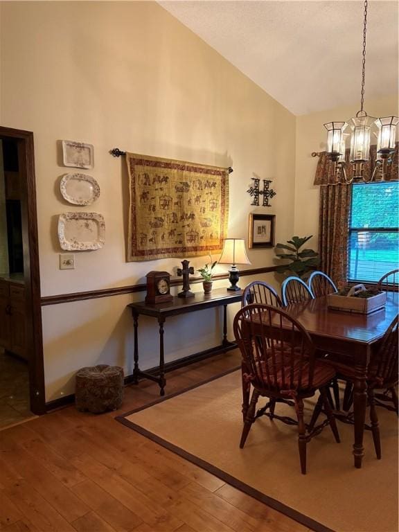 2236 Seneca Dr, Charleston, IL 61920 - dining room featuring hardwood / wood-style flooring, lofted ceiling, and a chandelier
