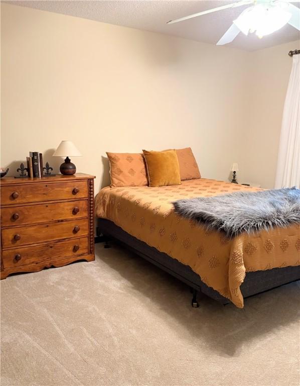 2236 Seneca Dr, Charleston, IL 61920 - bedroom with carpet flooring and ceiling fan