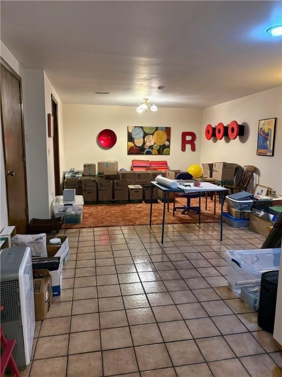 2236 Seneca Dr, Charleston, IL 61920 - playroom featuring light tile patterned flooring and a chandelier