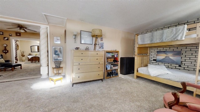 bedroom with light colored carpet, ceiling fan, and a textured ceiling