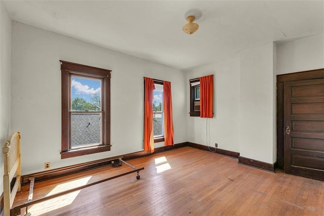 426 W Madison St, Paris, IL 61944 - unfurnished room featuring hardwood / wood-style flooring and baseboards