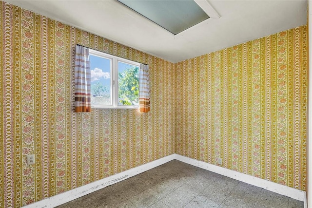 426 W Madison St, Paris, IL 61944 - empty room with tile patterned floors and baseboards