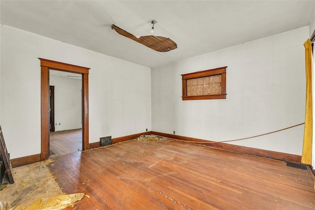 426 W Madison St, Paris, IL 61944 - spare room featuring wood-type flooring and baseboards