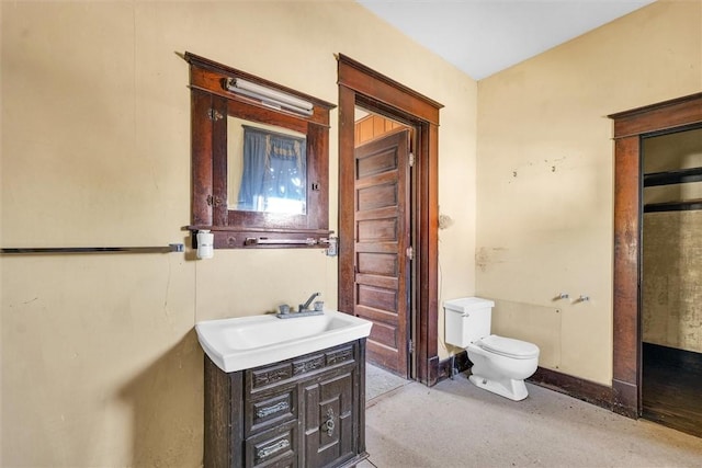 426 W Madison St, Paris, IL 61944 - bathroom featuring toilet, vanity, and baseboards