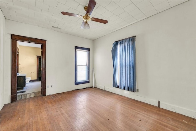 426 W Madison St, Paris, IL 61944 - spare room featuring hardwood / wood-style floors and a ceiling fan