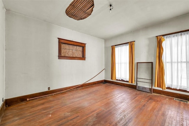 426 W Madison St, Paris, IL 61944 - empty room with wood-type flooring and baseboards