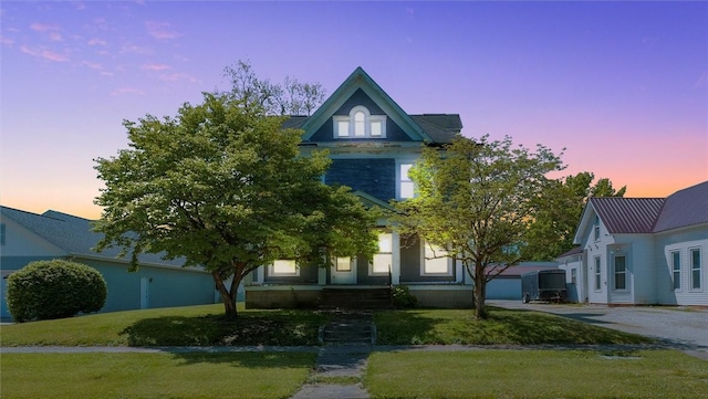 426 W Madison St, Paris, IL 61944 - view of front of home featuring a lawn and asphalt driveway