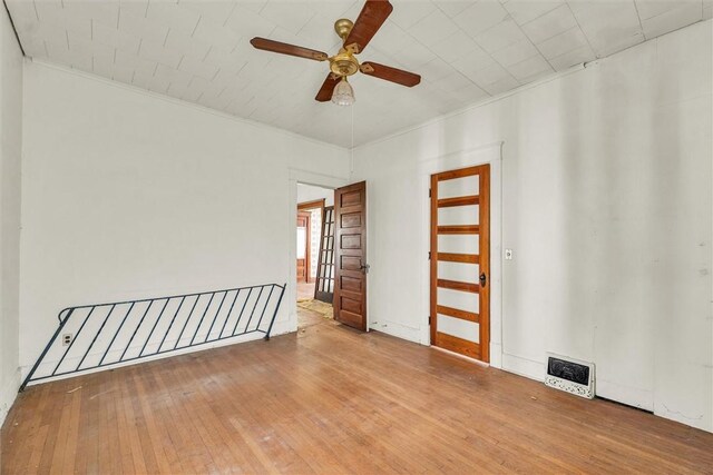 426 W Madison St, Paris, IL 61944 - spare room featuring a ceiling fan, ornamental molding, and hardwood / wood-style flooring
