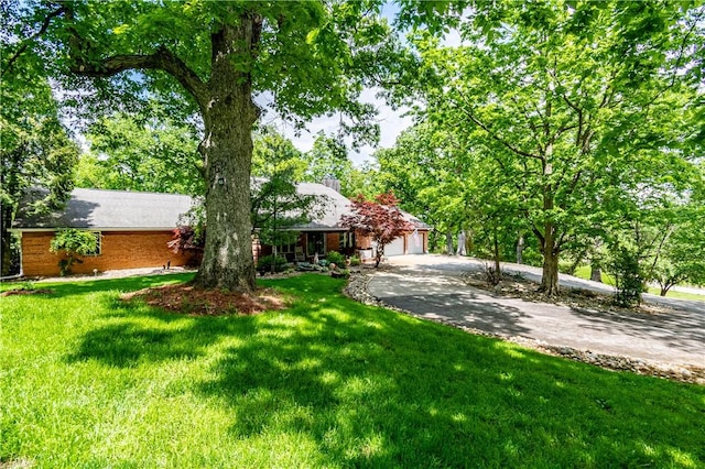 5353 E Reas Bridge Rd, Decatur, IL 62521 - view of front of property with asphalt driveway and a front yard