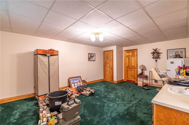 5353 E Reas Bridge Rd, Decatur, IL 62521 - playroom featuring dark carpet, a sink, baseboards, and a drop ceiling